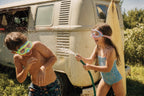 Two kids playing in Lakeday enclosed-nose swim masks